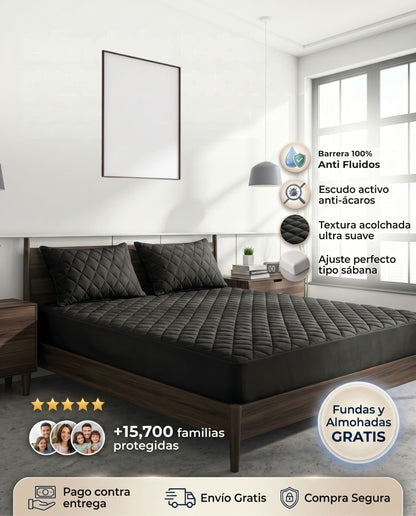 Protector de colchón negro Patmia con funda gratis y almohadas hipoalergénicas en la imagen de hogar.
